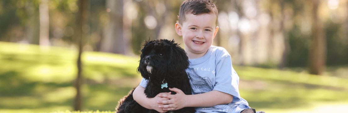 Image of child and their dog in Stirling Civic Gardens